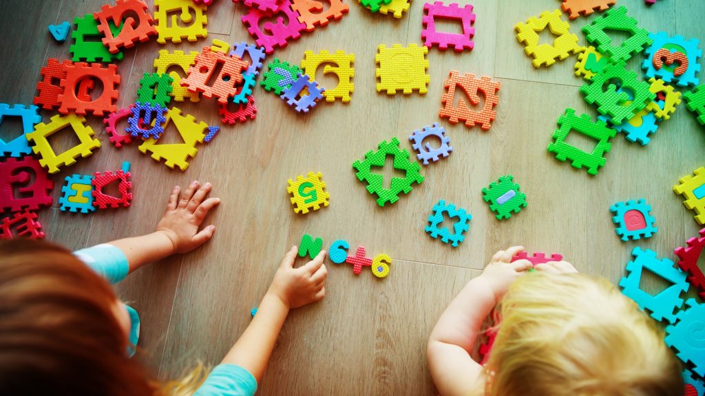 kids playing with puzzle, learning numbers and shapes, education